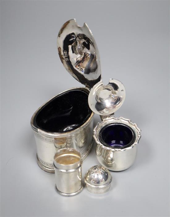An Edwardian silver oval mustard and four other small silver condiments.